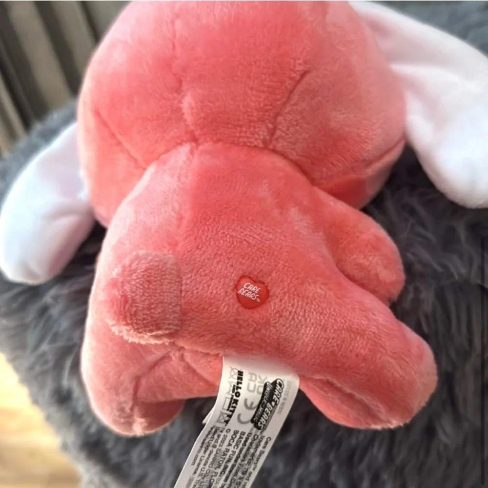 Hello Kitty Cinnamoroll plush dressed as Love-a-Lot Bear Care. Ear collaboration